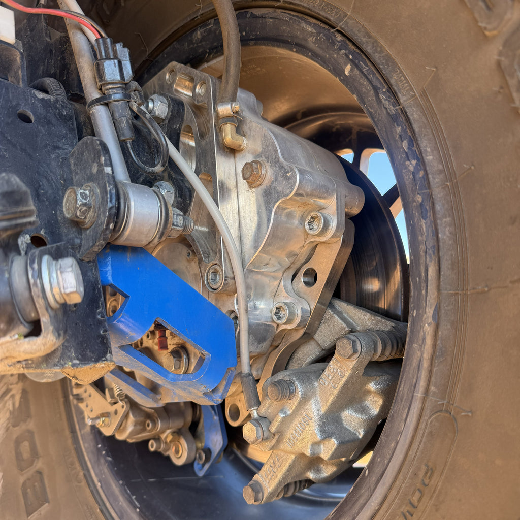 Portal Pros Jeep Wrangler portal axles installed on a Jeep JK on the back right axle and shows the lower support bracket that is included in the kit