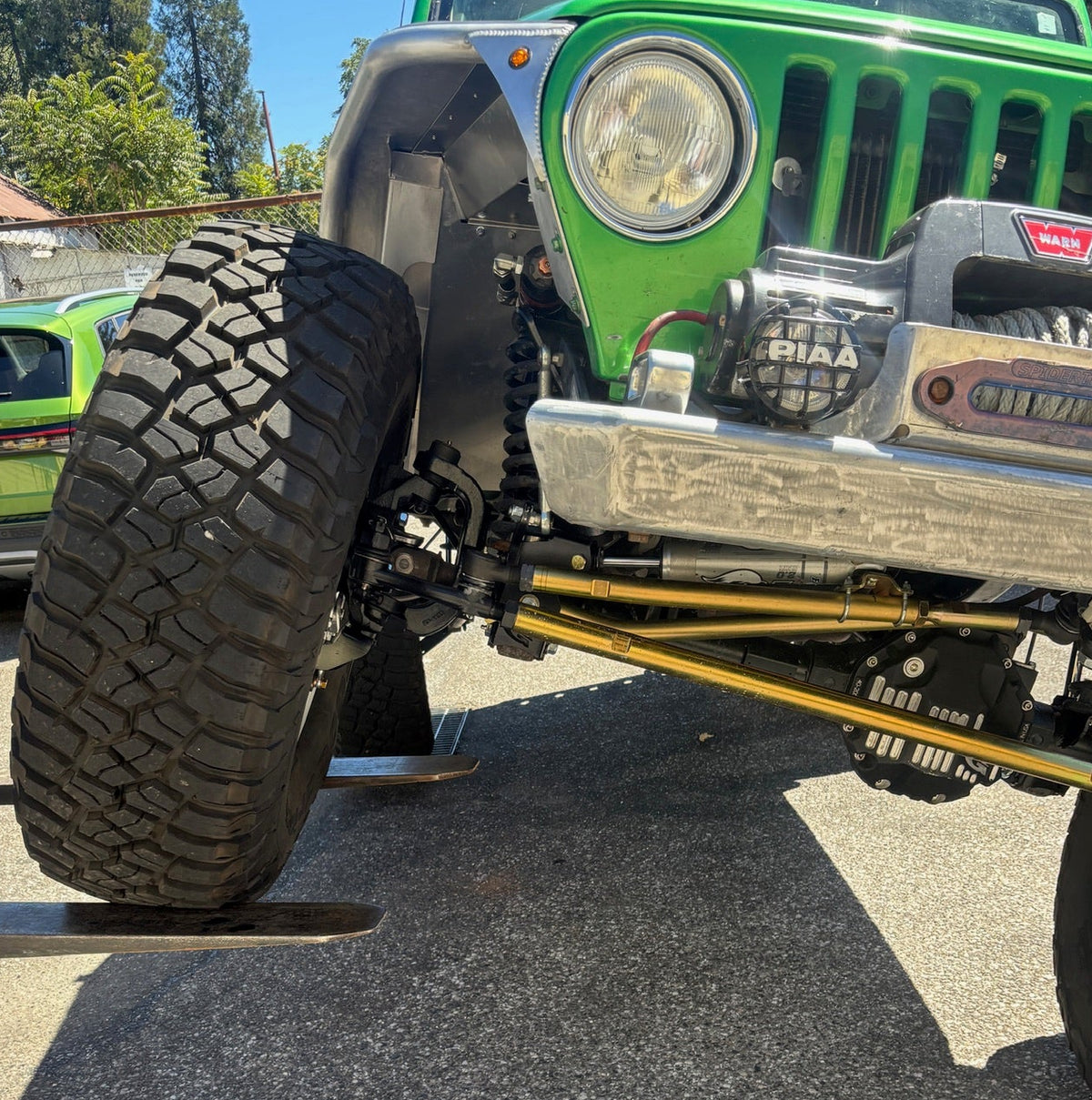 Close up view of Portal Pros bolt-on portal axles installed on a Jeep Wrangler TJ Rubicon Unlimited also known as an LJ - showing front right portal on the OEM axle